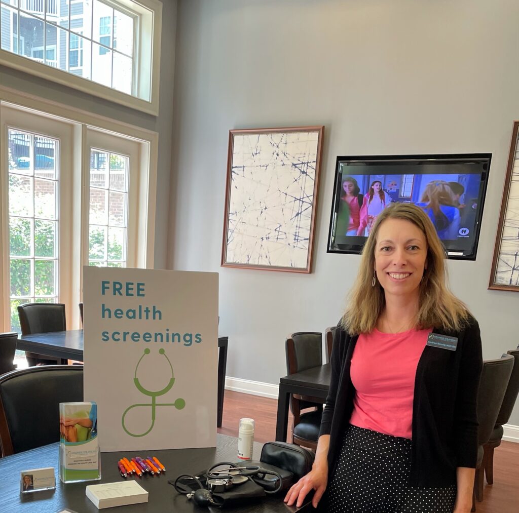 This is a photograph of Andrea Bendig, owner of Wellness Strategies Group, at a wellness event in Howard County, Maryland.