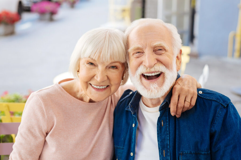 senior couple making laugh looking camera
